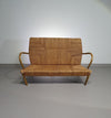 Vintage Franse papercordbank met een metalen frame