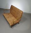 Vintage Franse papercordbank met een metalen frame