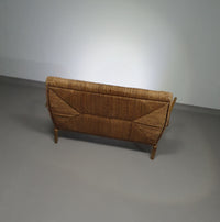 Vintage Franse papercordbank met een metalen frame