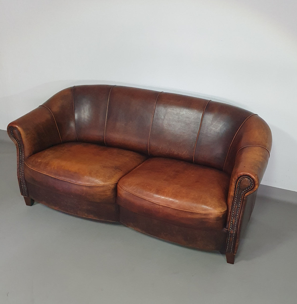 Beautiful subtly designed sheep leather club chair / sofa from the Joris brand.