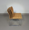 Stapelbare rieten, rotan stoelen (4) model S.21 op een verchroomde stalen structuur. Ontworpen door Tito Agnoli