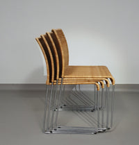 Stapelbare rieten, rotan stoelen (4) model S.21 op een verchroomde stalen structuur. Ontworpen door Tito Agnoli