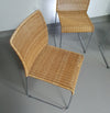 Stapelbare rieten, rotan stoelen (4) model S.21 op een verchroomde stalen structuur. Ontworpen door Tito Agnoli