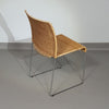 Stapelbare rieten, rotan stoelen (4) model S.21 op een verchroomde stalen structuur. Ontworpen door Tito Agnoli