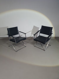 2 leren chromen klapstoelen