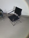 2 leren chromen klapstoelen