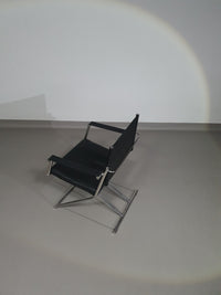 2 leren chromen klapstoelen