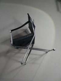 2 leren chromen klapstoelen