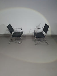 2 leren chromen klapstoelen