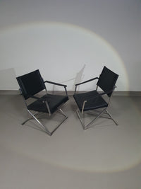 2 leren chromen klapstoelen
