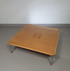 Rare coffee table 110 x 110 x height 35 cm
with 8 flange wooden / cork caps in the glass top.