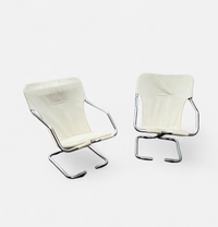 2 x Tubular chrome cantilever chair with a cream canvas sling