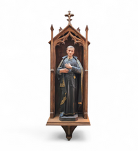 Statue of a religious figure / Patron Saint Gerard Majella / placed in a Gothic niche / labeled /