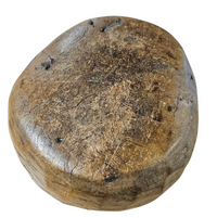 A substantial hand-hewn wooden bowl carved from a single burl section