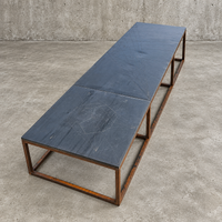 Weighty coffee table / solid iron frame / stone slate table tops / made on commission by architect Alex Vervoordt / Belgium 1990s /