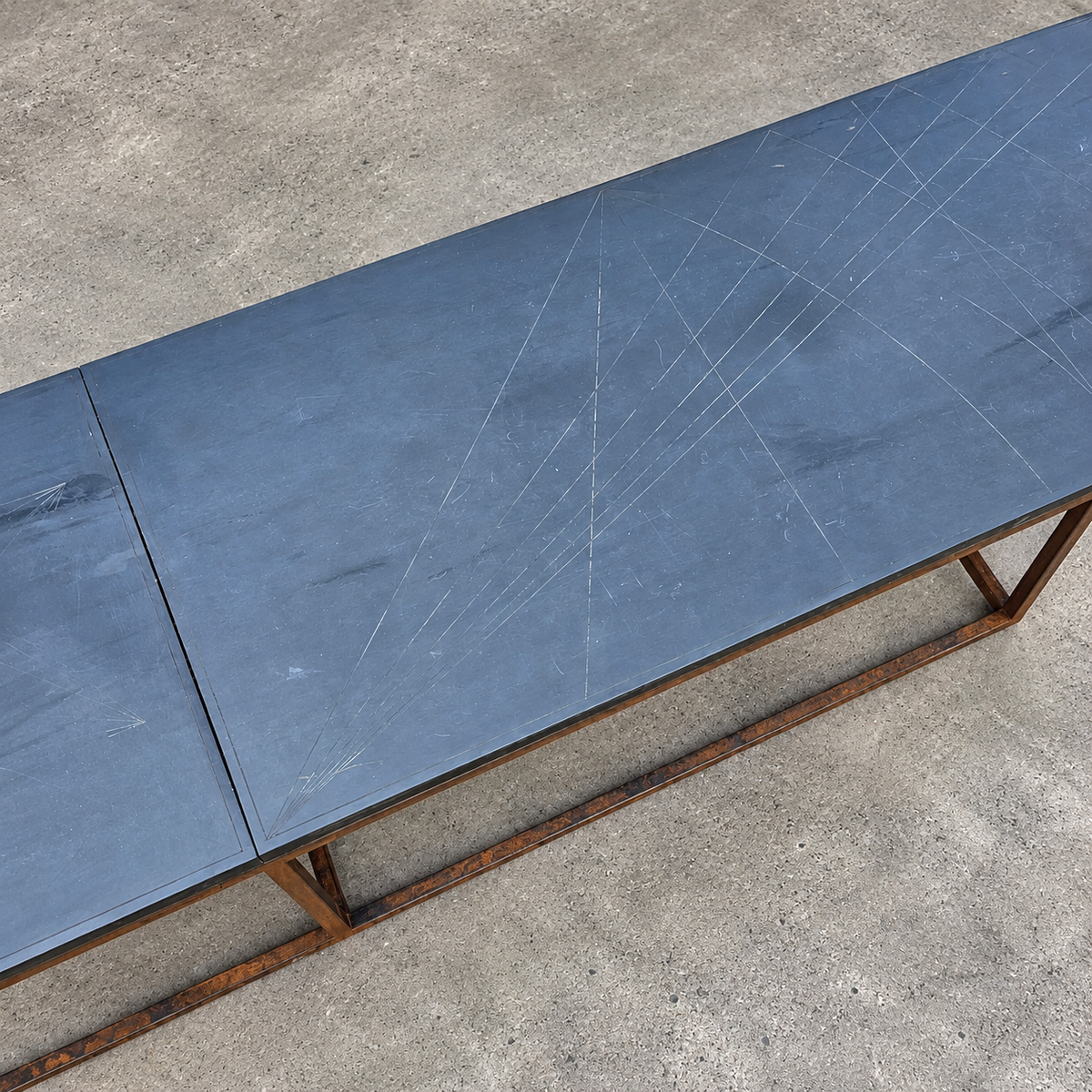 Weighty coffee table / solid iron frame / stone slate table tops / made on commission by architect Alex Vervoordt / Belgium 1990s /