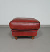 BAXTER hocker/poef in stierenleer.
 Kashmir Rubis kleur 1993