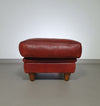 BAXTER hocker/poef in stierenleer.
 Kashmir Rubis kleur 1993