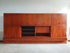 Grote wandkast V-vorm 360 x 175 cm
 Bestaat uit 4 boven delen ( met bureauklep) en 4 onderdelen met lades jaren 60
