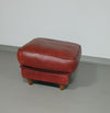 BAXTER hocker/poef in stierenleer.
 Kashmir Rubis kleur 1993