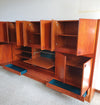 Grote wandkast V-vorm 360 x 175 cm
 Bestaat uit 4 boven delen ( met bureauklep) en 4 onderdelen met lades jaren 60