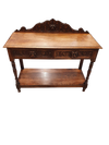 Victoriaanse gotische eikenhouten bijzettafel, decoratief gesneden rond 1920. Groene maskerdecoratie