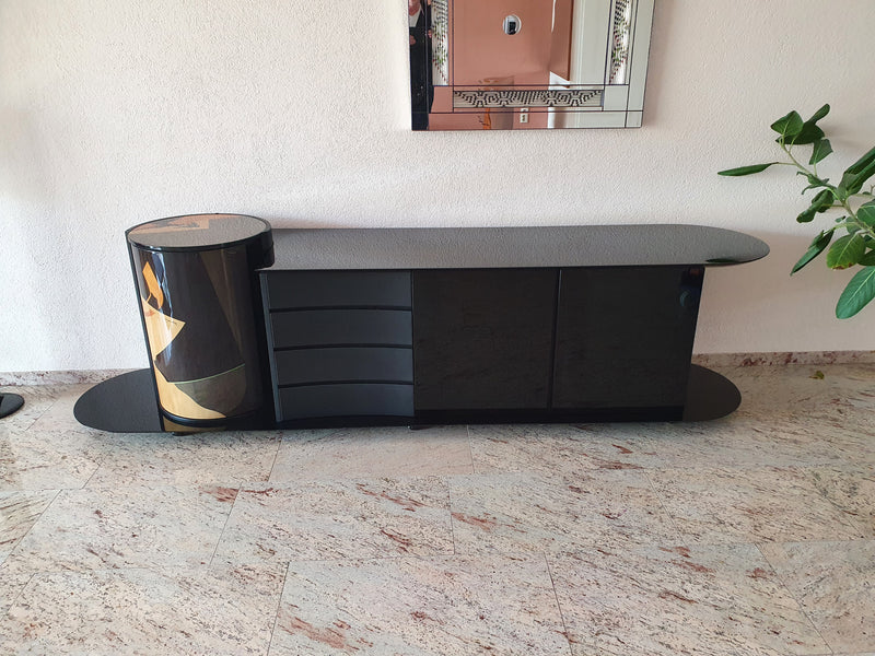 Unique dressoir by Carlo Malnati, produced around the 1980’s. The art work is made out of inlaid wood, using different colored pieces to create the design. 260 x 77 x 70 deep
