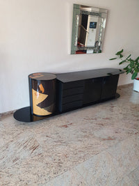 Unique dressoir by Carlo Malnati, produced around the 1980’s. The art work is made out of inlaid wood, using different colored pieces to create the design. 260 x 77 x 70 deep